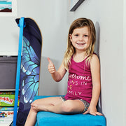 Young girl sitting on a blue chair with a Butterfly SlackBoard leaning against a wall.