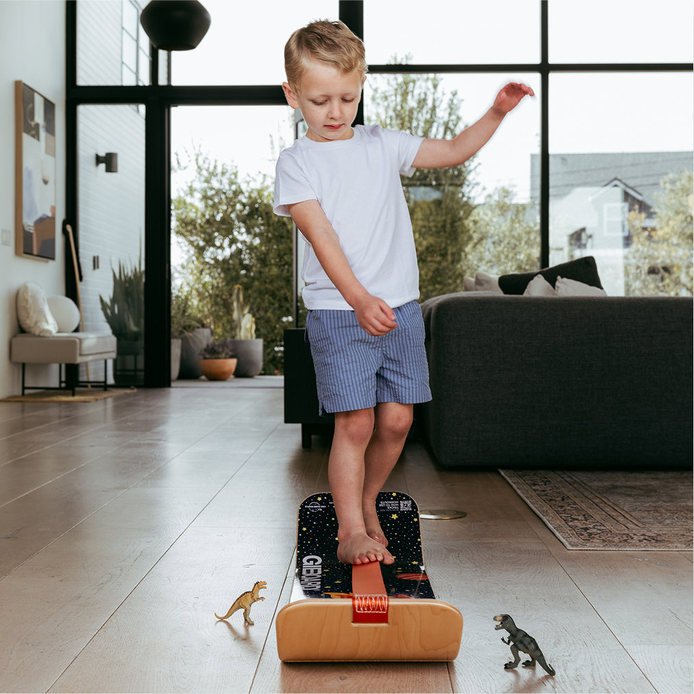Child on an Astro SlackBoard in a living room.
